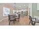 Bright dining area with hardwood floors and views of the modern kitchen at 4230 Old Cherokee St, Acworth, GA 30101