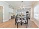 Elegant dining area with hardwood floors, chandelier, and views of the living room at 4230 Old Cherokee St, Acworth, GA 30101