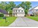 Charming two-story home with a well-manicured lawn and a two-car garage at 4230 Old Cherokee St, Acworth, GA 30101