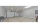 Spacious three car garage with white doors and ample storage space at 4230 Old Cherokee St, Acworth, GA 30101