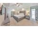 Bright main bedroom features a tray ceiling, a ceiling fan, carpet and an ensuite bathroom at 4230 Old Cherokee St, Acworth, GA 30101