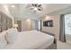 Bright main bedroom features a tray ceiling, a ceiling fan, carpet and an ensuite bathroom at 4230 Old Cherokee St, Acworth, GA 30101