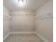 A spacious walk-in closet with white walls and metal shelving, offering ample storage space at 4230 Old Cherokee St, Acworth, GA 30101