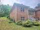 Side of the home with a view of the screened in porch at 4855 West Price Rd, Sugar Hill, GA 30518