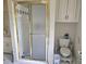 Bathroom features white tile, vanity with storage and a standing shower at 4855 West Price Rd, Sugar Hill, GA 30518