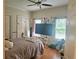 Bedroom features hardwood floors, ceiling fan and natural light at 4855 West Price Rd, Sugar Hill, GA 30518