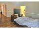 Spacious bedroom with hardwood floors and neutral walls at 4855 West Price Rd, Sugar Hill, GA 30518