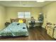 Bedroom with hardwood floors, and natural light at 4855 West Price Rd, Sugar Hill, GA 30518