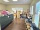 Room filled with boxes, hardwood floors and natural light at 4855 West Price Rd, Sugar Hill, GA 30518