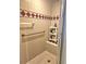 Walk-in shower features tile walls and a built-in bench at 4855 West Price Rd, Sugar Hill, GA 30518