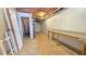 Unfinished basement area featuring sturdy support beams and a door leading to stairs, offering potential living space at 4905 Puritan Dr, Sugar Hill, GA 30518