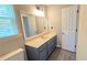 Bathroom featuring a wide vanity, a large mirror and updated vinyl flooring at 4905 Puritan Dr, Sugar Hill, GA 30518