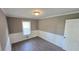 Cozy bedroom with neutral paint, modern floors, and bright natural light at 4905 Puritan Dr, Sugar Hill, GA 30518