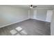 Spacious bedroom with neutral colors, ceiling fan, and durable vinyl flooring at 4905 Puritan Dr, Sugar Hill, GA 30518