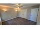 Bedroom with hardwood floors, neutral walls, and recessed lights at 4905 Puritan Dr, Sugar Hill, GA 30518