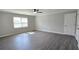 Spacious bedroom with neutral colors, ceiling fan, and durable vinyl flooring at 4905 Puritan Dr, Sugar Hill, GA 30518