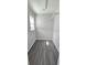 Empty closet features durable wood flooring and natural light from window at 4905 Puritan Dr, Sugar Hill, GA 30518