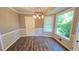 Bright dining room features modern lighting, neutral paint, and hardwood flooring at 4905 Puritan Dr, Sugar Hill, GA 30518