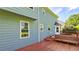 Home exterior features a wood deck, back door, and garden hose and wood siding at 4905 Puritan Dr, Sugar Hill, GA 30518