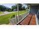 Cozy front porch featuring wood flooring and white railings, offering a pleasant view of the neighborhood at 4905 Puritan Dr, Sugar Hill, GA 30518