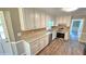 Updated kitchen featuring granite counters, stainless appliances, and ample storage at 4905 Puritan Dr, Sugar Hill, GA 30518