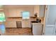 Bright kitchen featuring updated countertops, stainless steel appliances, and white cabinetry at 4905 Puritan Dr, Sugar Hill, GA 30518