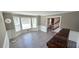 Bright living room featuring a large bay window and elegant hardwood floors at 4905 Puritan Dr, Sugar Hill, GA 30518