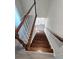 Beautiful staircase features dark wood treads and white risers with painted wood handrail at 4905 Puritan Dr, Sugar Hill, GA 30518