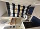 Modern bathroom with striped shower curtain, and modern cabinets at 6070 Ridge Way, Douglasville, GA 30135