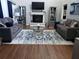 Beautiful living room with hardwood floors, stylish furniture, and a cozy fireplace at 6070 Ridge Way, Douglasville, GA 30135