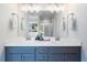 Bright bathroom featuring double sinks, vanity, modern fixtures, and a large mirror at 1048 Shadow Glen Dr, Fairburn, GA 30213