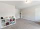 Spacious room with plush carpet and a storage unit; perfect for storage or playroom at 1048 Shadow Glen Dr, Fairburn, GA 30213