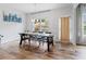 Dining area featuring a contemporary table, elegant lighting, and large windows at 1048 Shadow Glen Dr, Fairburn, GA 30213
