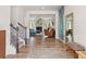 Inviting foyer with hardwood floors, staircase, and an open view to the living area at 1048 Shadow Glen Dr, Fairburn, GA 30213