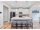 Bright, modern kitchen with quartz counters, stainless appliances, and island seating at 1048 Shadow Glen Dr, Fairburn, GA 30213