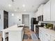 Well-equipped kitchen featuring white cabinets, stainless steel appliances, and quartz countertops at 1048 Shadow Glen Dr, Fairburn, GA 30213