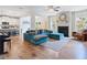 Spacious living room with hardwood floors, fireplace, and plenty of natural light at 1048 Shadow Glen Dr, Fairburn, GA 30213