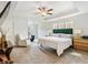 Spacious main bedroom featuring carpet flooring, a ceiling fan, and a sitting area at 1048 Shadow Glen Dr, Fairburn, GA 30213