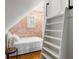 Attic bedroom with ladder and colorful wallpaper at 10975 Hutcheson Ferry Rd, Chattahoochee Hills, GA 30268