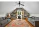 Finished attic bonus room featuring built-in bookshelves and comfortable seating at 10975 Hutcheson Ferry Rd, Chattahoochee Hills, GA 30268