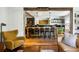 Stylish kitchen featuring a large island with seating, exposed beams, and pendant lighting at 10975 Hutcheson Ferry Rd, Chattahoochee Hills, GA 30268