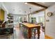 Open-concept kitchen with wood island, stainless appliances, and bright natural light at 10975 Hutcheson Ferry Rd, Chattahoochee Hills, GA 30268
