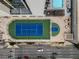 Aerial view of tennis/basketball courts next to a pool on the building's rooftop at 1280 W Peachtree Nw St # 1013, Atlanta, GA 30309