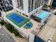Aerial view of rooftop tennis and basketball courts plus a swimming pool at 1280 W Peachtree Nw St # 1013, Atlanta, GA 30309