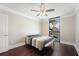 This bedroom features dark wood floors, large windows, and a modern ceiling fan at 1280 W Peachtree Nw St # 1013, Atlanta, GA 30309