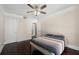 This bedroom features dark wood floors, large windows, and a modern ceiling fan at 1280 W Peachtree Nw St # 1013, Atlanta, GA 30309