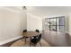 Bright dining area features hardwood floors and a large window, creating an inviting space to enjoy meals at 1280 W Peachtree Nw St # 1013, Atlanta, GA 30309
