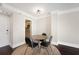 Dining area featuring dark wood floors and a round table perfect for enjoying meals near the adjacent kitchen at 1280 W Peachtree Nw St # 1013, Atlanta, GA 30309