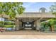 The Arts Center Transit Station entrance, enhanced by trees and a colorful rail, for easy commuting at 1280 W Peachtree Nw St # 1013, Atlanta, GA 30309