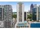 High-rise building featuring a rooftop pool and tennis court, perfect for luxury living with stunning city views at 1280 W Peachtree Nw St # 1013, Atlanta, GA 30309